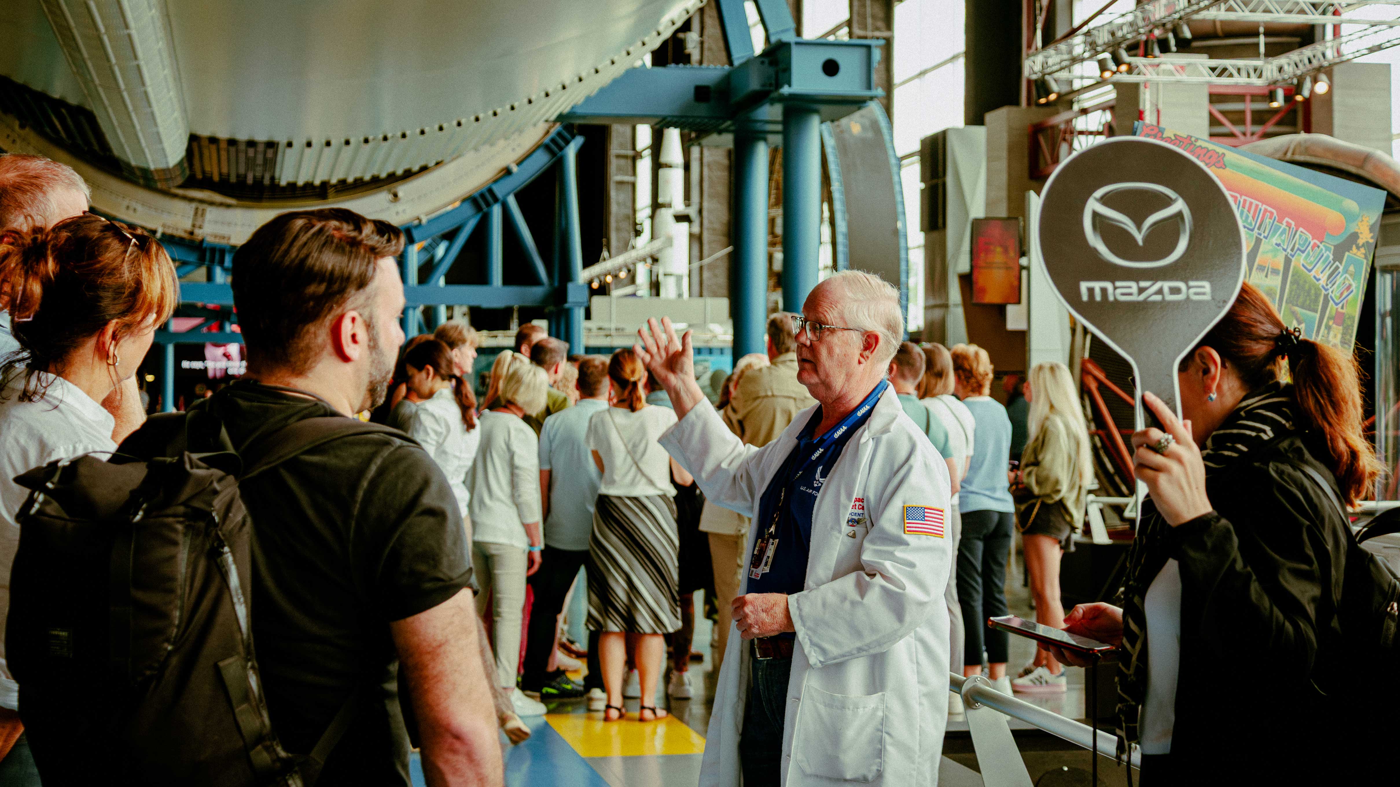 Docent giving Mazda guests a tour.
