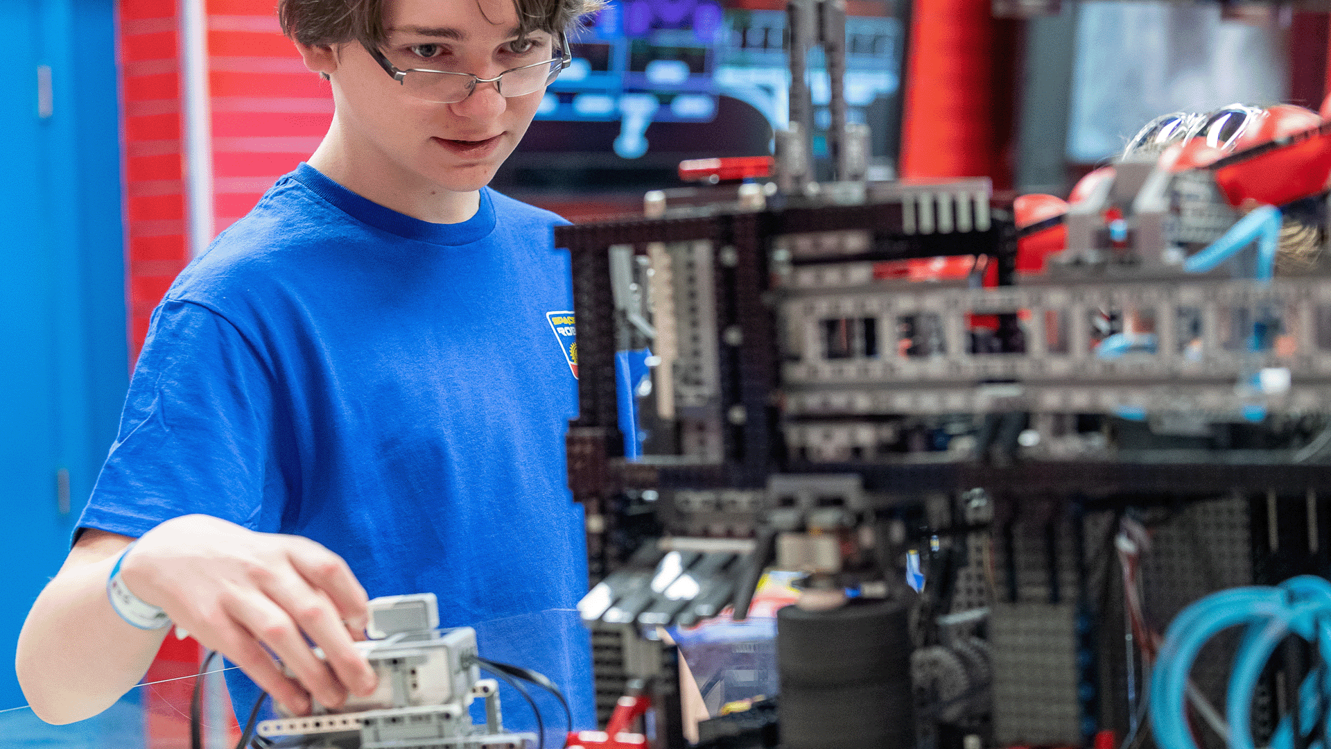Space Camp Robotics trainee working on a robotics build