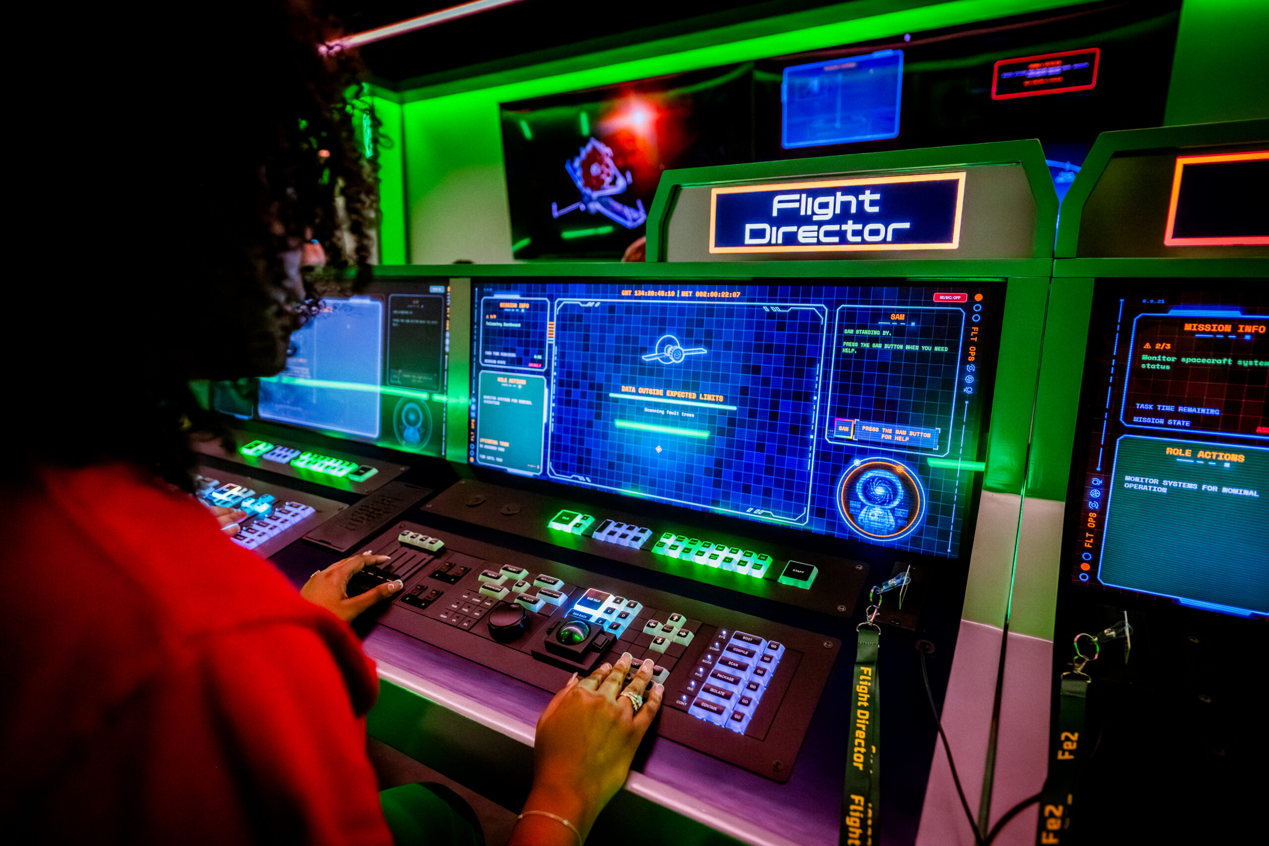 Adult participating as the flight director in the new Inspiration4 building