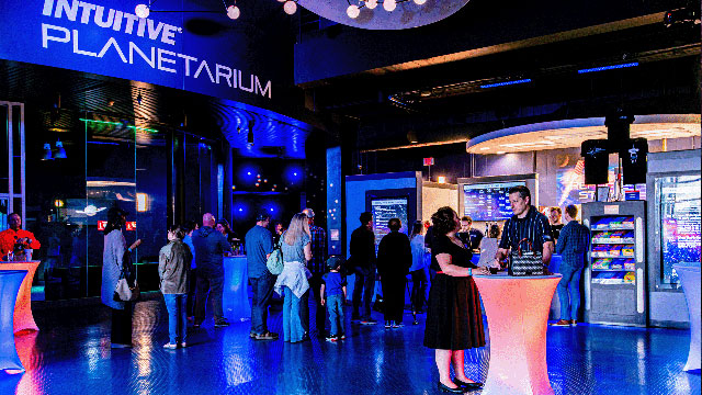 A group of people gathered together before a Cocktails and Cosmos show