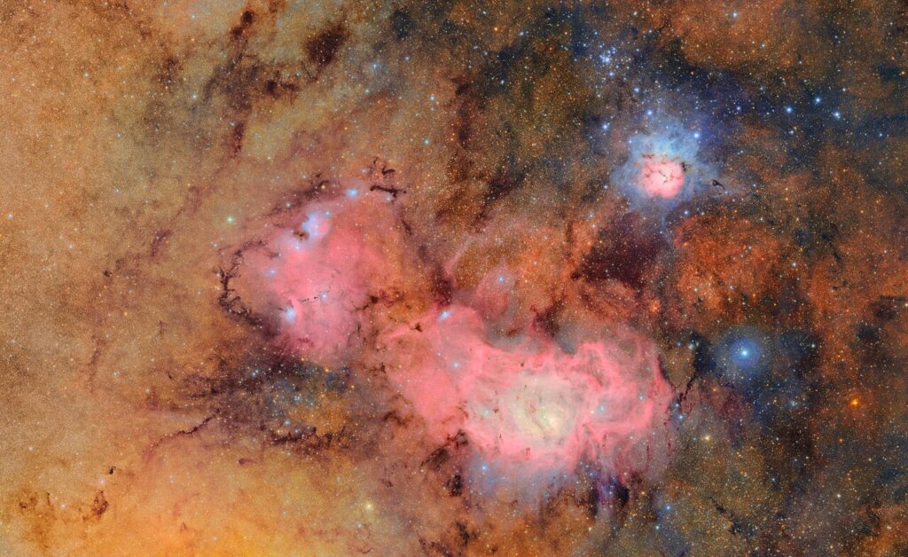 The Trifid Nebula (also referred to as Messier 20) is a standout in the sky. It’s a bright, colorful cloud of gas and dust about 5,000 light-years away in the constellation Sagittarius.