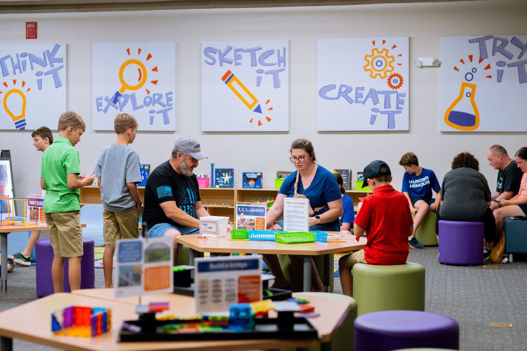 Children and parents entertaining themselves in Spark!Lab.