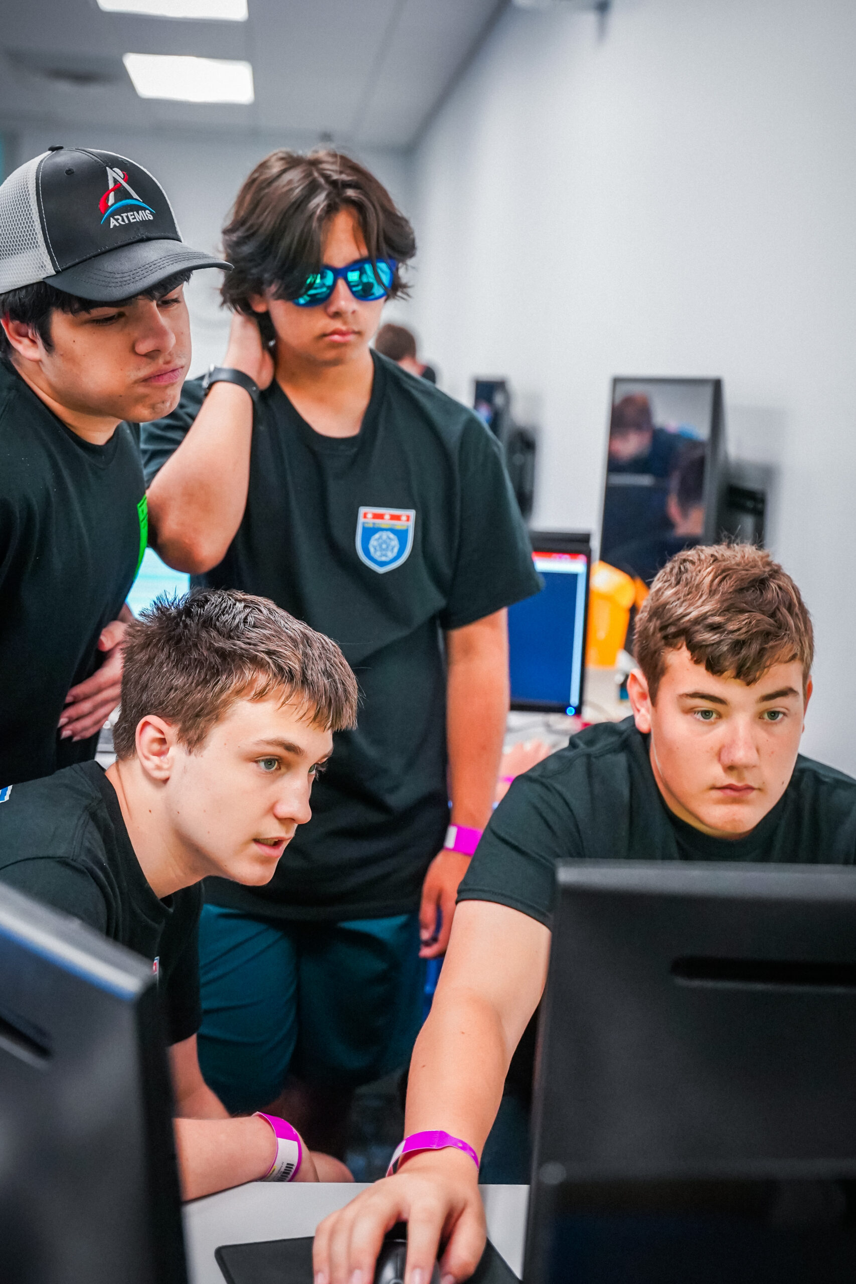 a group of cyber campers working together to complete their mission